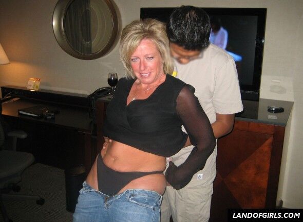 Free porn pics of Blonde mature American woman has sex with Indian man on holidays 2 of 6 pics